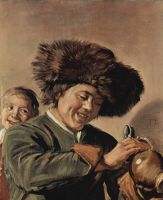 Two smiling young men with a beer mug