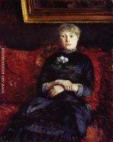 Woman Sitting on a Red Flowered Sofa