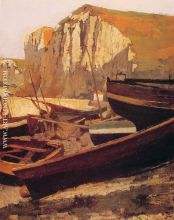 Boats at the foot of a cliff in Normandy