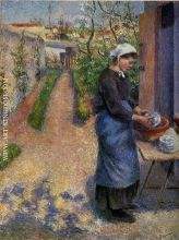 Young Woman Washing Plates